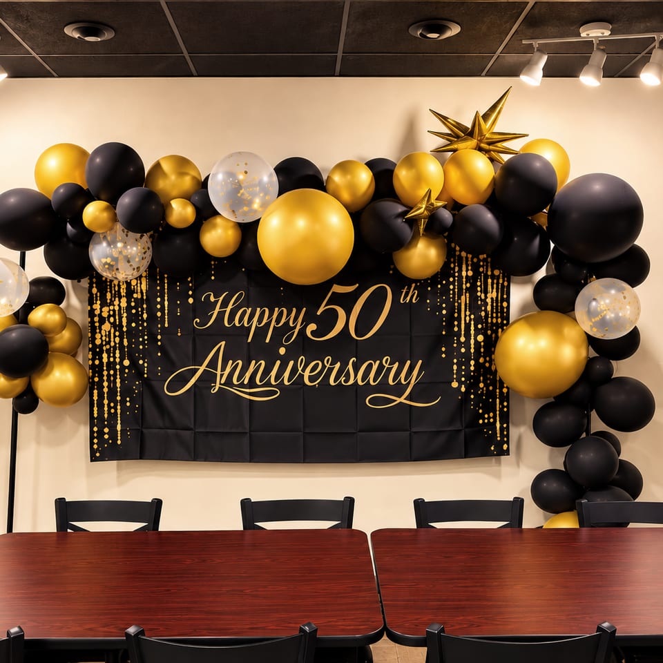50th anniversary celebration with black and gold balloons at Kabob Cafe & Grill.
